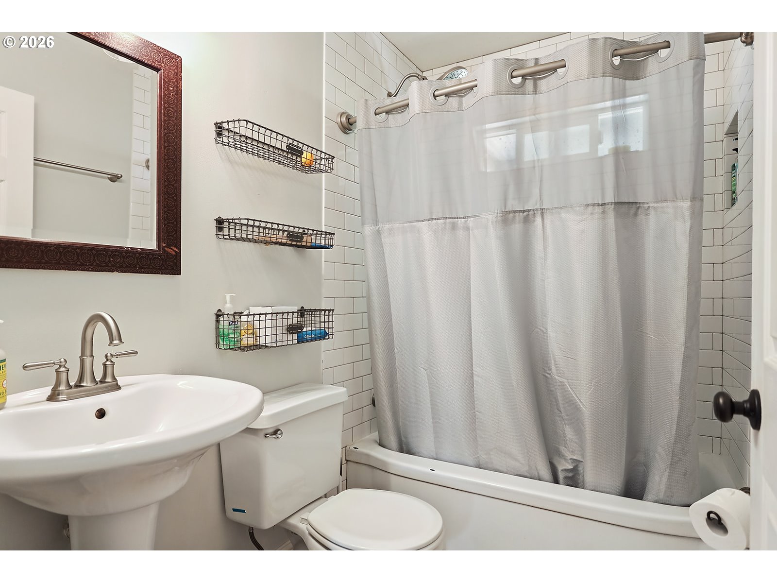 1214 Walnut Street The Dalles, OR 97058 - Photo 12 of 29 a bathroom with a sink a toilet and shower