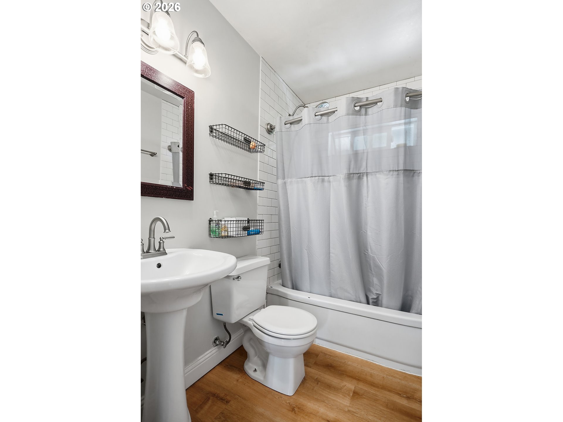 1214 Walnut Street The Dalles, OR 97058 - Photo 13 of 29 a bathroom with a toilet a sink and a shower