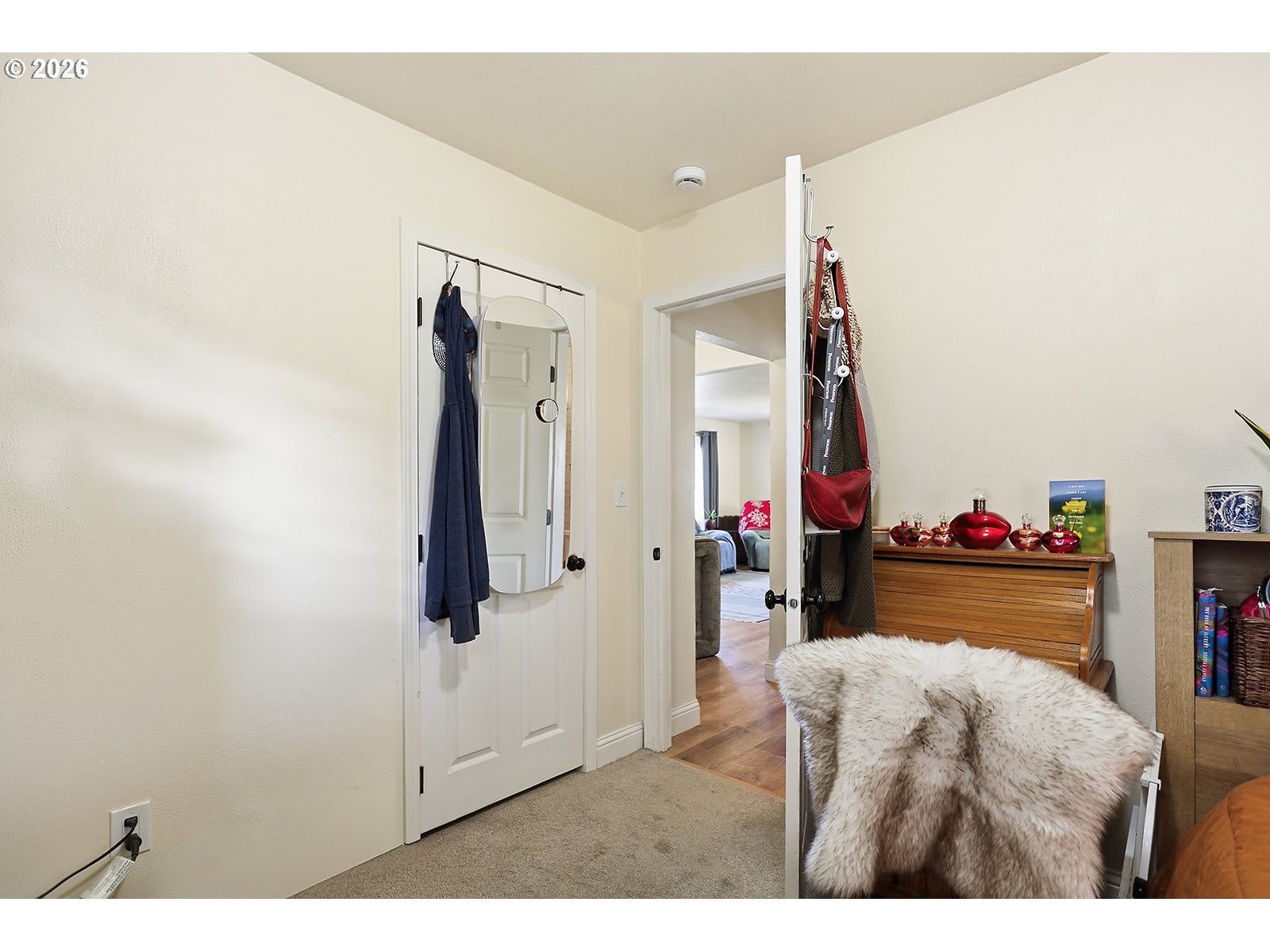 1214 Walnut Street The Dalles, OR 97058 - Photo 17 of 29 a bed room with a bed and a mirror