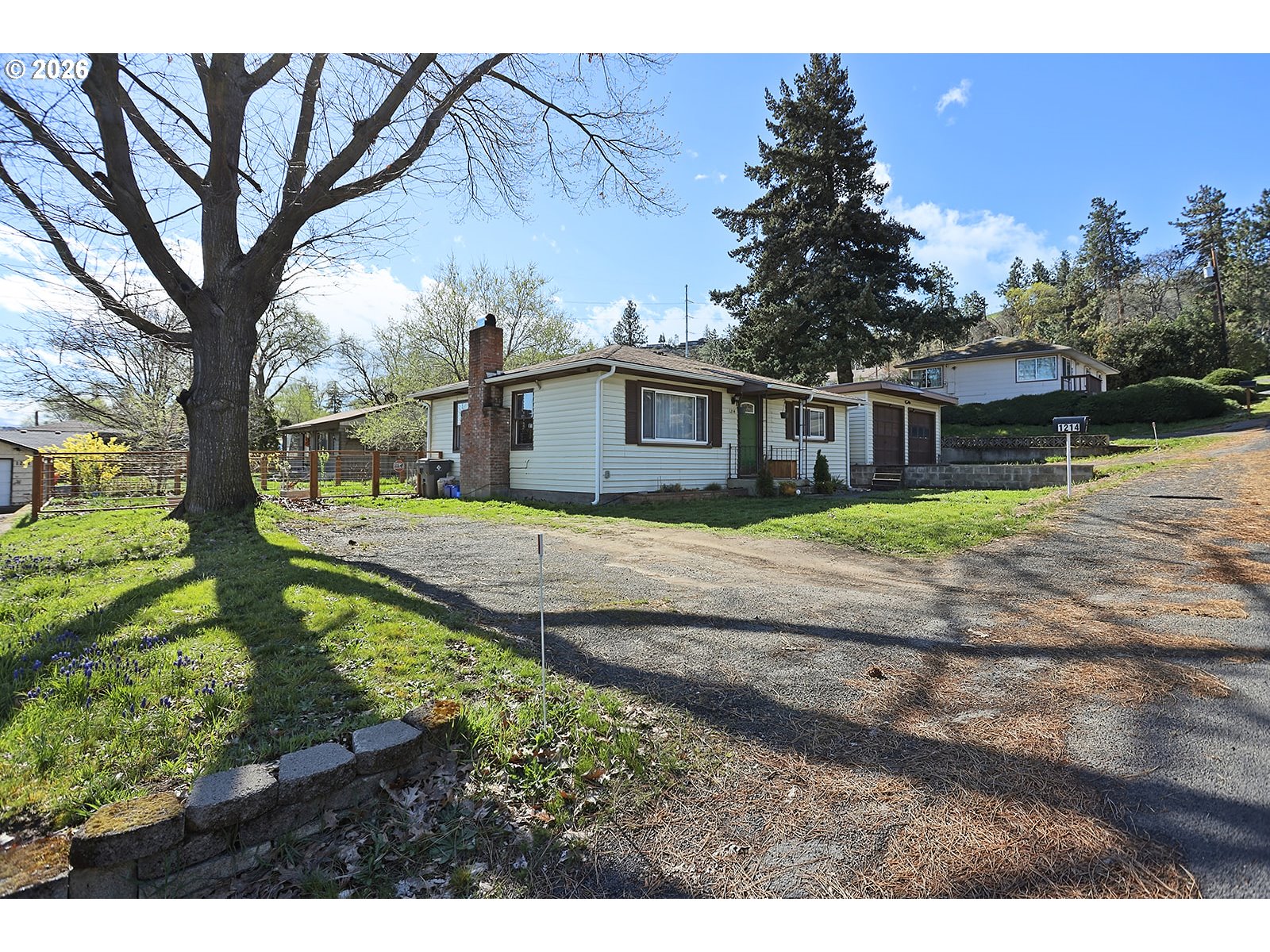 1214 Walnut Street The Dalles, OR 97058 - Photo 2 of 29 a view of a house with backyard and a tree