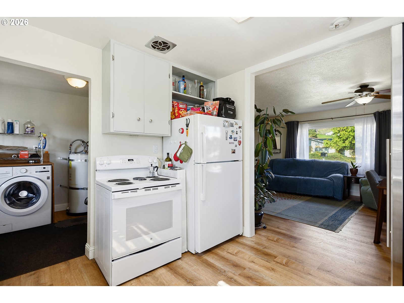 1214 Walnut Street The Dalles, OR 97058 - Photo 21 of 29 a kitchen with a refrigerator a stove a washer and dryer