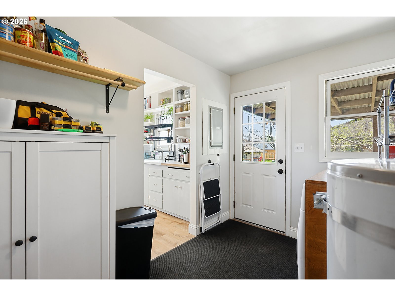 1214 Walnut Street The Dalles, OR 97058 - Photo 23 of 29 a view of kitchen with white cabinets and window