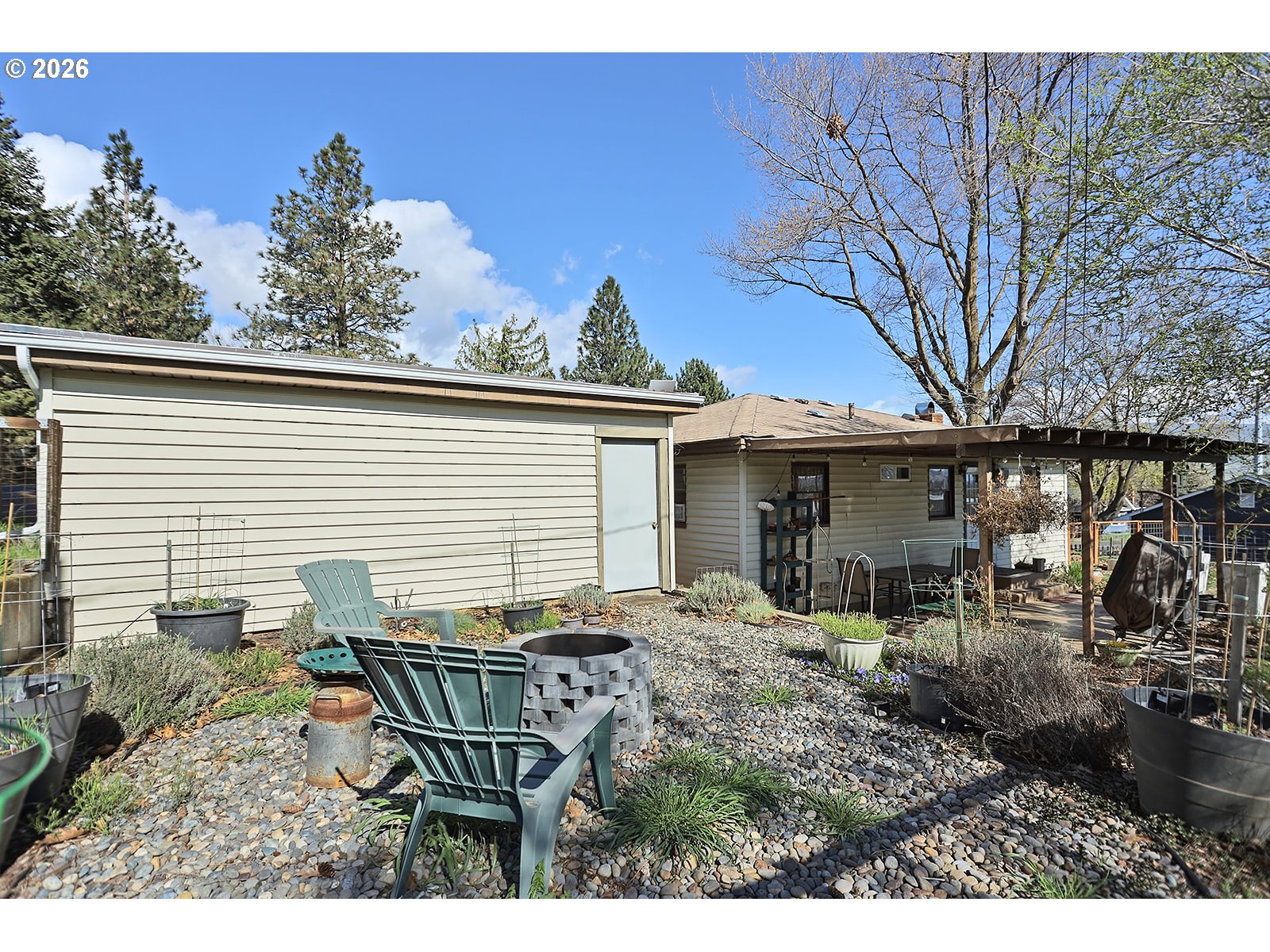1214 Walnut Street The Dalles, OR 97058 - Photo 27 of 29 a view of a house with backyard and sitting area