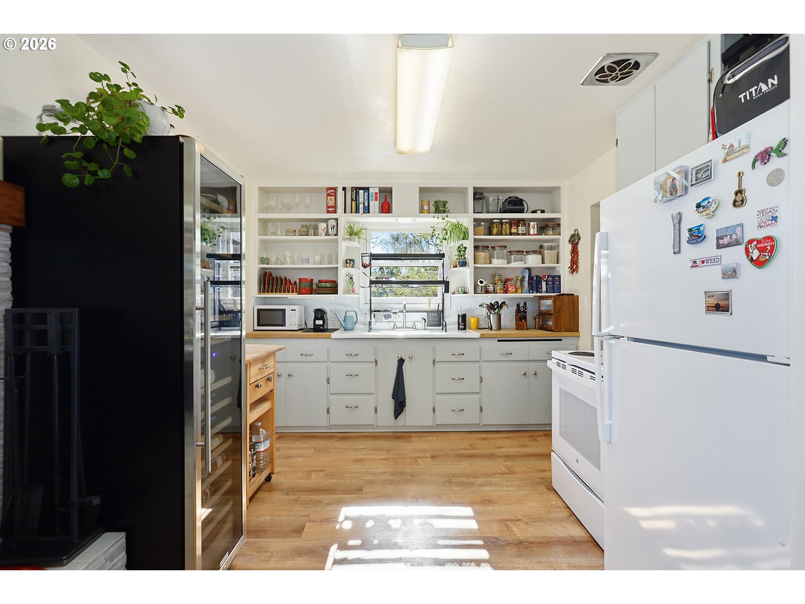 1214 Walnut Street The Dalles, OR 97058 - Photo 8 of 29 a kitchen with refrigerator and cabinets
