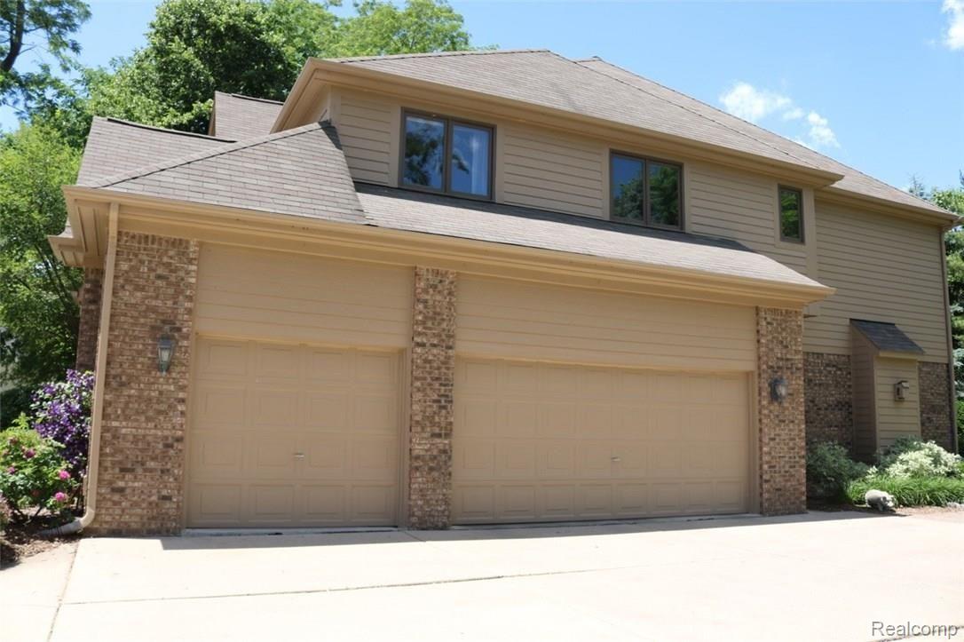 CHECKOUT THE "OVERSIZED" 3 CAR SIDE ENTRY GARAGE
