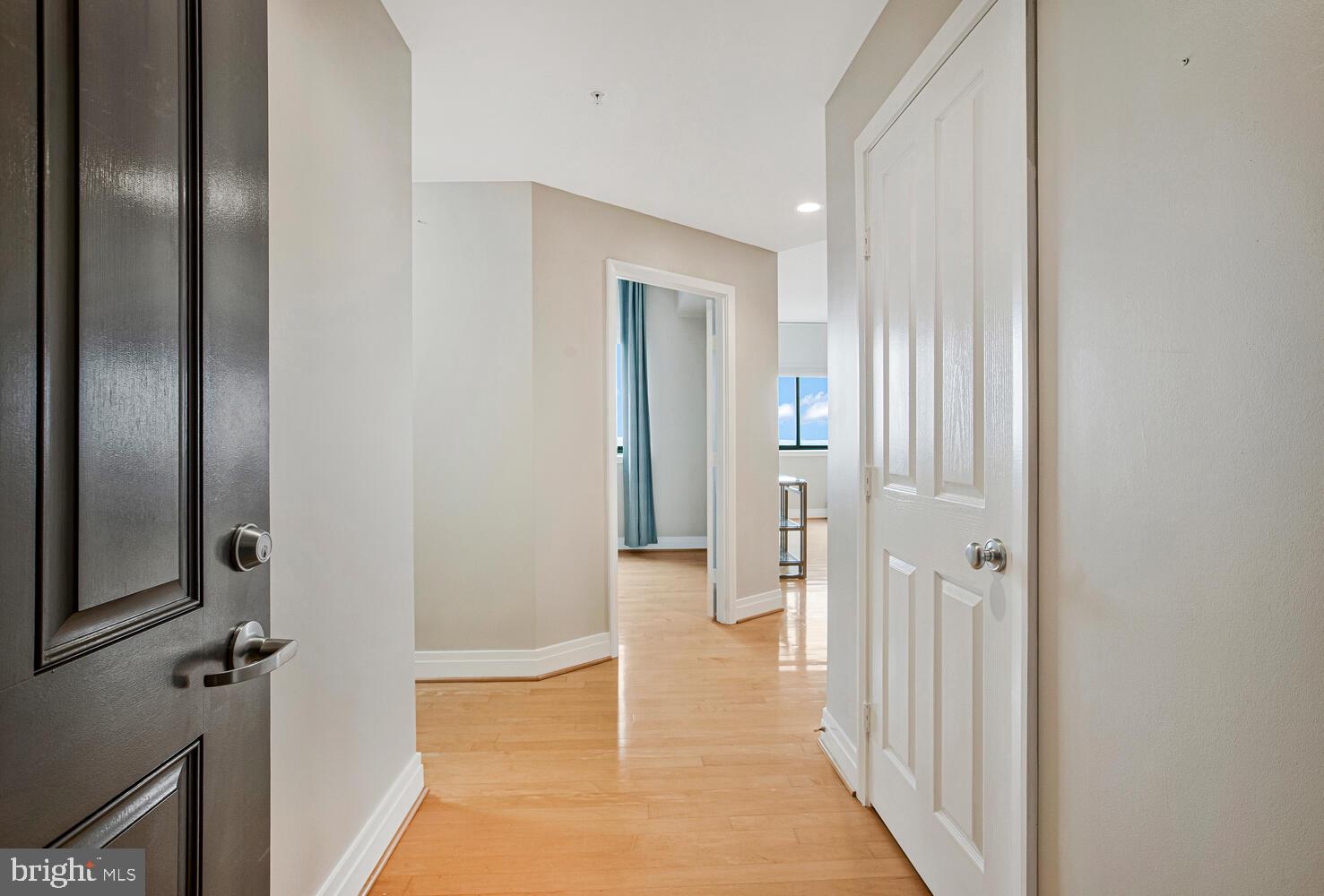 414 Water Street, Unit 2913 Baltimore, MD 21202 - Photo 35 of 41 a view of a hallway with wooden floor