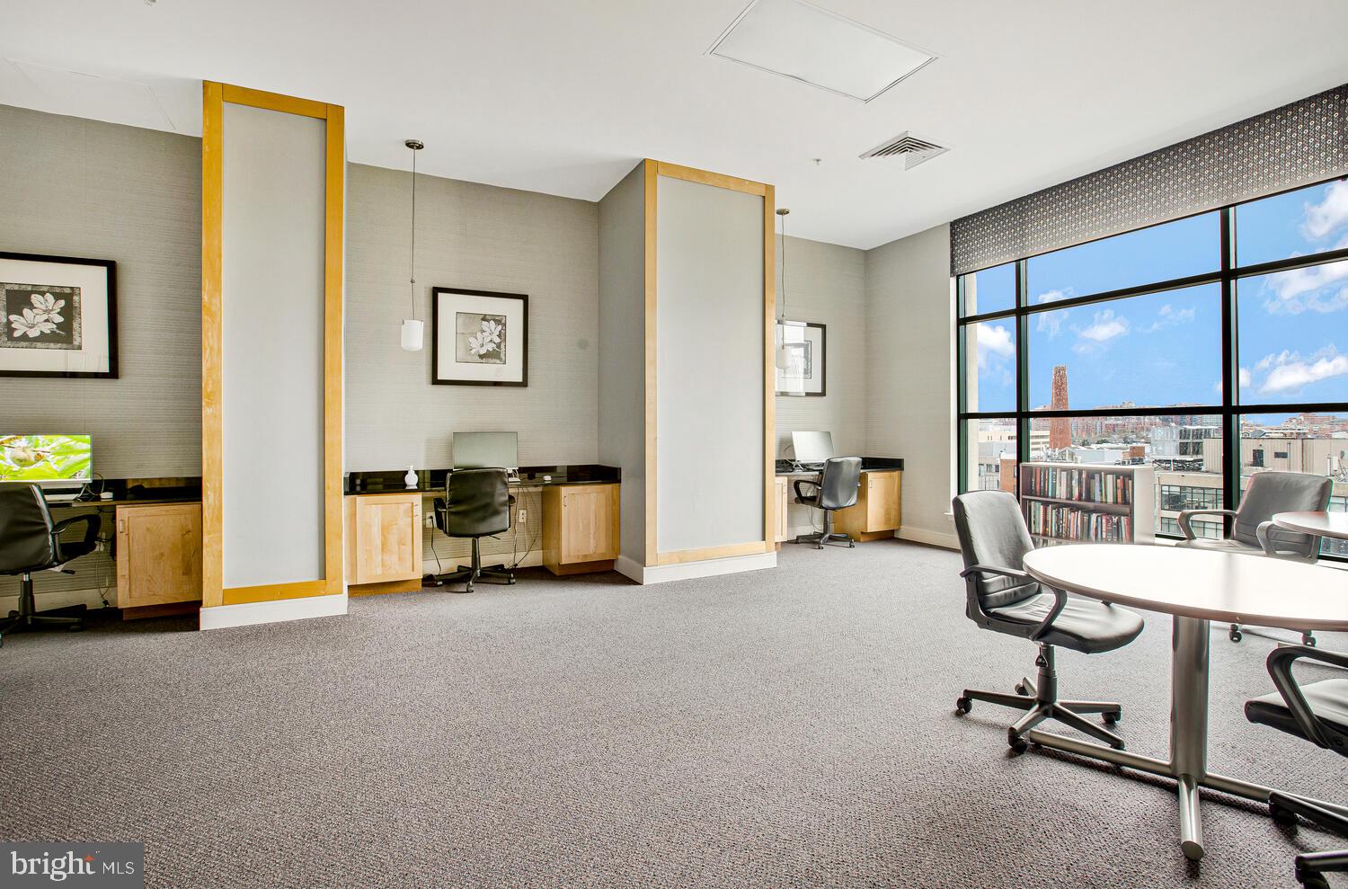414 Water Street, Unit 2913 Baltimore, MD 21202 - Photo 5 of 41 a view of a livingroom with gym equipment