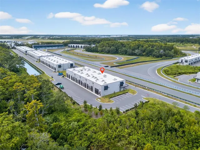 an aerial view of a house with a garden