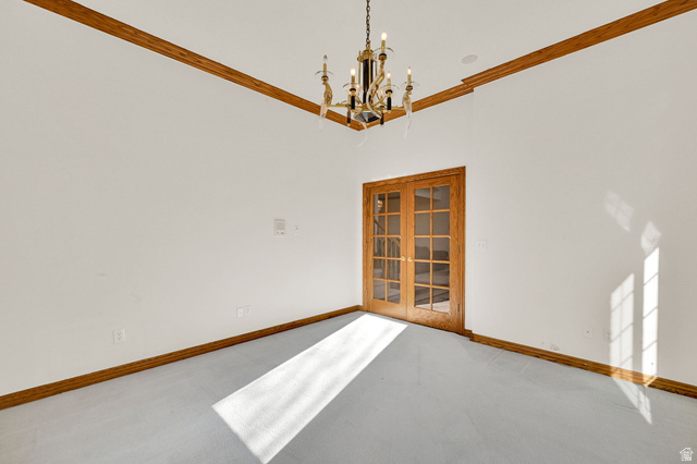 1085 Windsor Drive Provo, UT 84604 - Photo 25 of 83 Carpeted empty room with a chandelier and ornamental molding