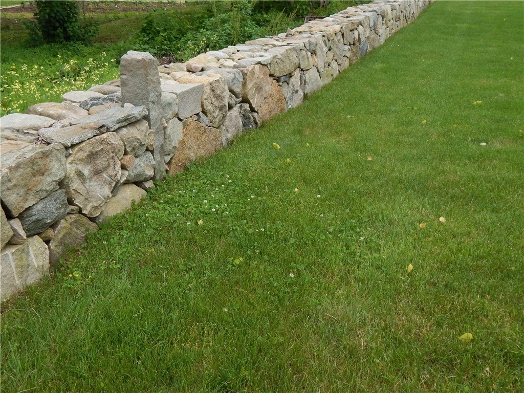 414 Bradford Road Westerly, RI 02808 - Photo 2 of 18 Beautiful stone wall borders the rear of the property
