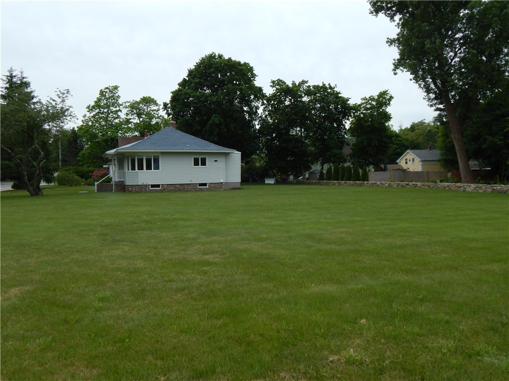 414 Bradford Road Westerly, RI 02808 - Photo 3 of 18 Large side yard provides plenty of room for an addition, garage, or just a lot of space to play in!