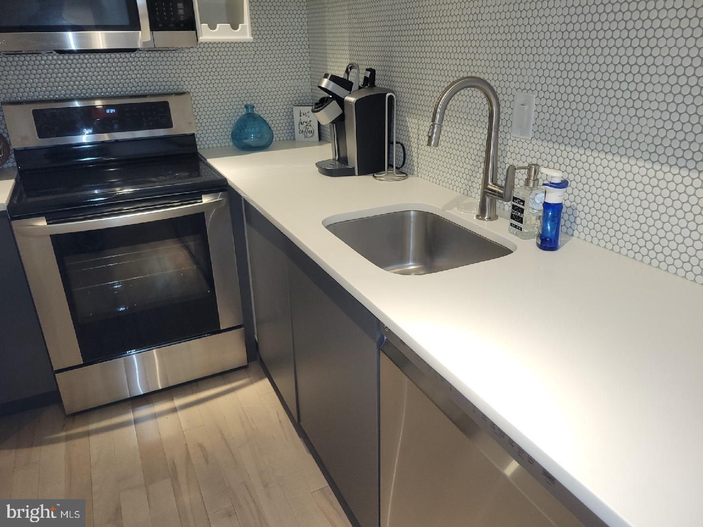 41 Q Street Northwest, Unit B Washington, DC 20001 - Photo 12 of 21 Sleek kitchen with modern finishes.