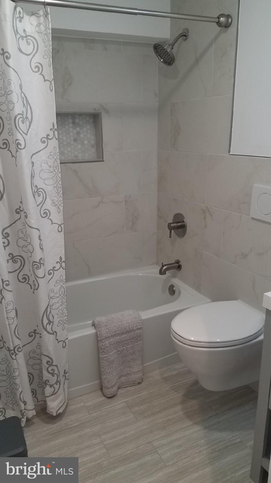 41 Q Street Northwest, Unit B Washington, DC 20001 - Photo 16 of 21 Modern bathroom with elegant finishes.