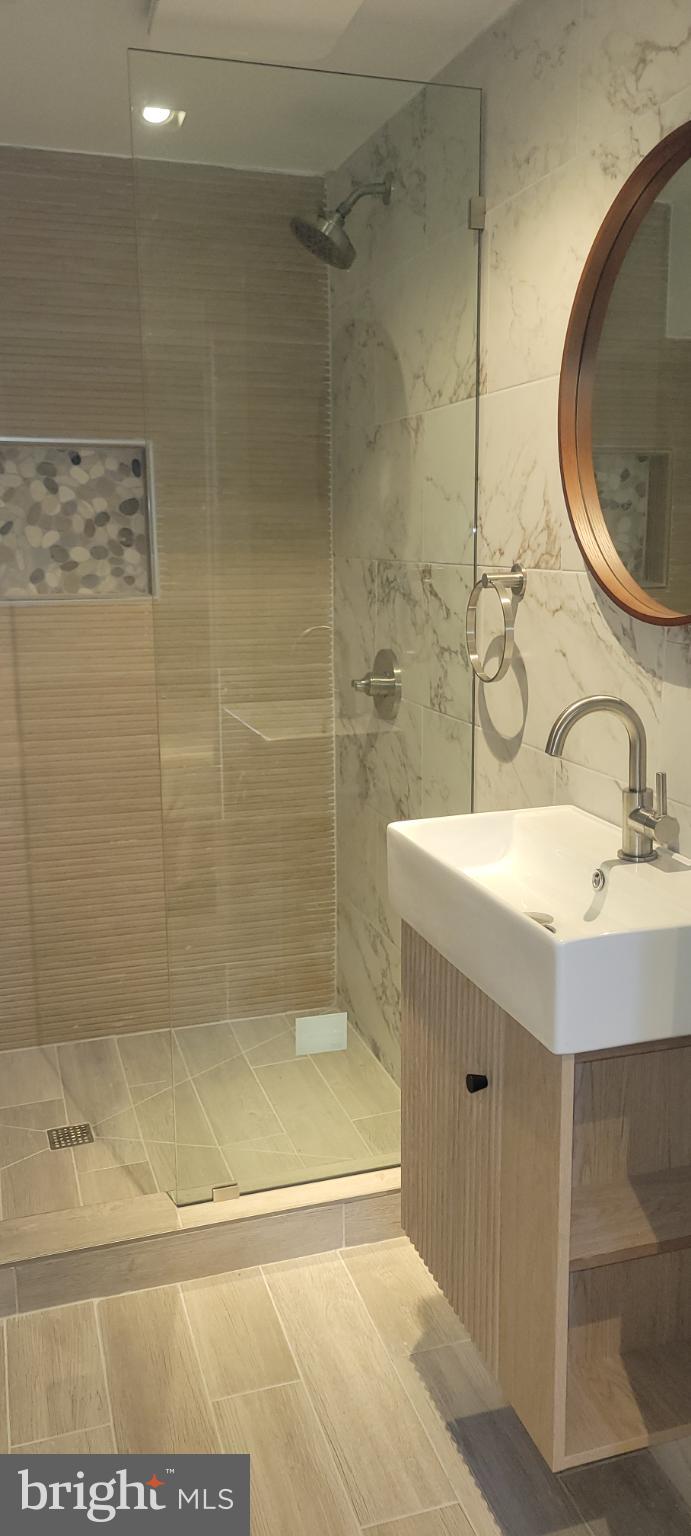 41 Q Street Northwest, Unit B Washington, DC 20001 - Photo 20 of 21 Sleek modern bathroom with elegant finishes.