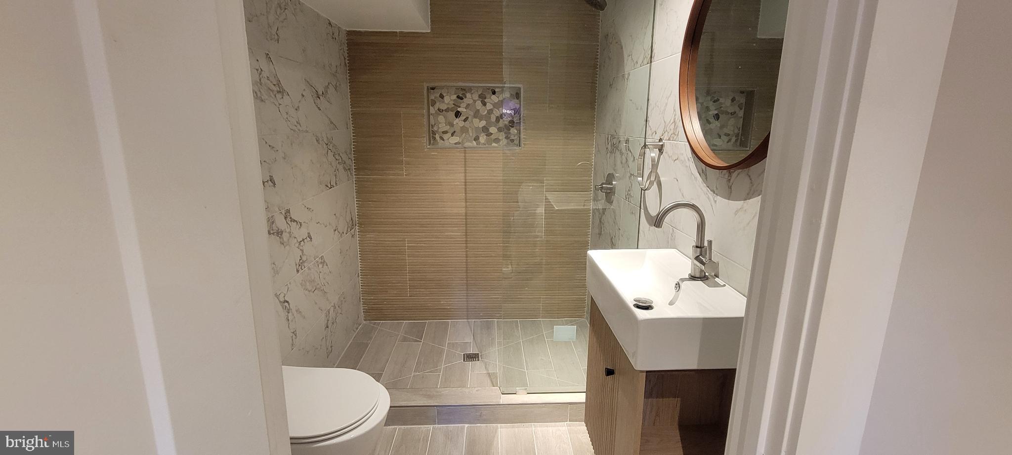 41 Q Street Northwest, Unit B Washington, DC 20001 - Photo 21 of 21 Sleek modern bathroom with elegant finishes.