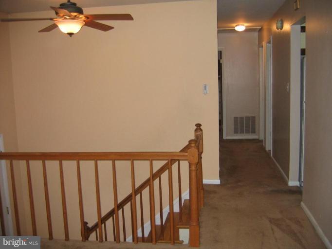 913 Emory Church Road Upperco, MD 21155 - Photo 15 of 30 Hallway leads to bedrooms. Newer Fan.