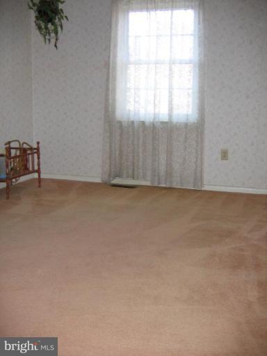 913 Emory Church Road Upperco, MD 21155 - Photo 4 of 30 Nice bedroom with neutral carpet and 2 windows