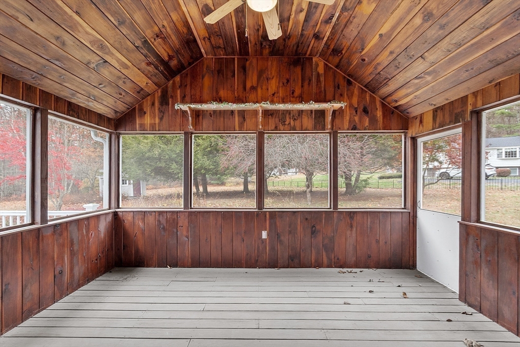 80 A Nashua Road Pepperell, MA 01463 - Photo 11 of 19 a view of an empty room with wooden floor and a window