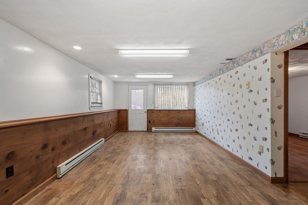 80 A Nashua Road Pepperell, MA 01463 - Photo 12 of 19 a view of an empty room with wooden floor
