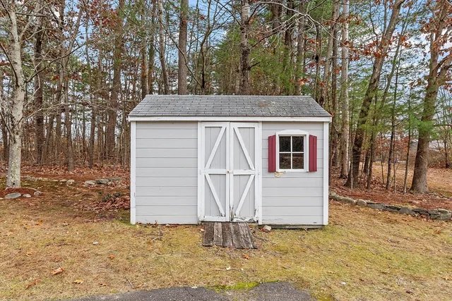 a view of house with backyard of house