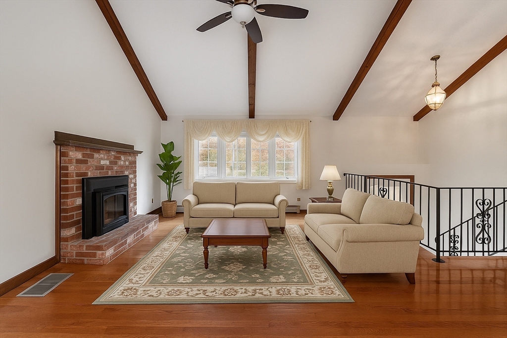 80 A Nashua Road Pepperell, MA 01463 - Photo 2 of 19 a living room with furniture and a fireplace
