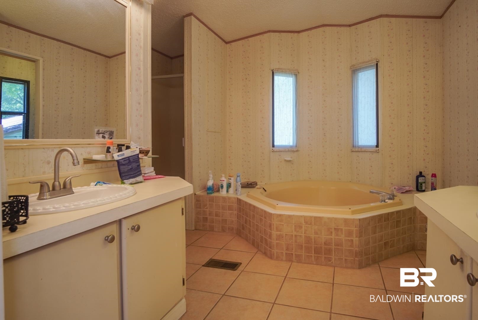 9190 County Road 97 Elberta, AL 36530 - Photo 31 of 53 Bathroom with tile patterned floors, vanity, plenty of natural light, and tiled bath