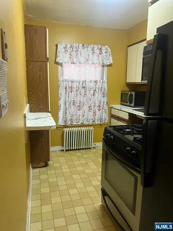 a kitchen with a sink and a microwave