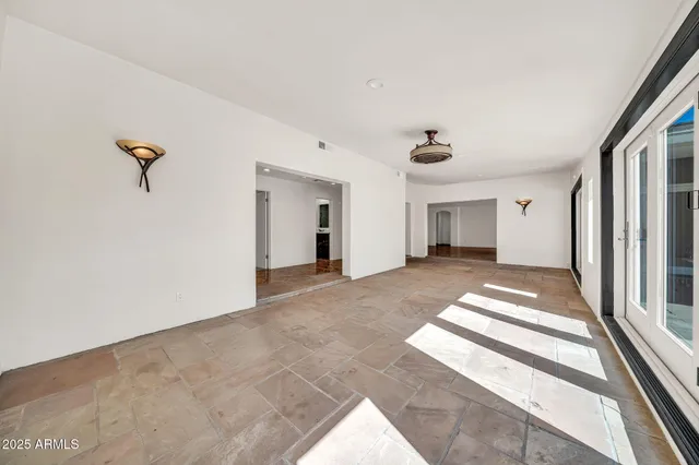 a kitchen with stainless steel appliances granite countertop a sink a stove and cabinets