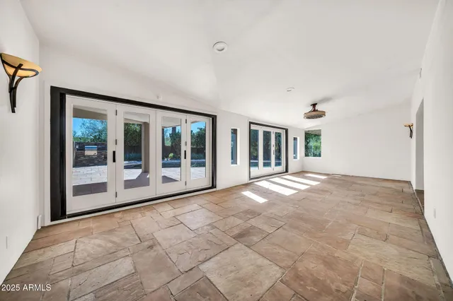 a kitchen with stainless steel appliances granite countertop a stove sink and cabinets