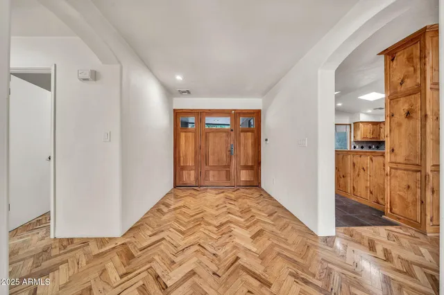 a bathroom with a sink mirror and vanity