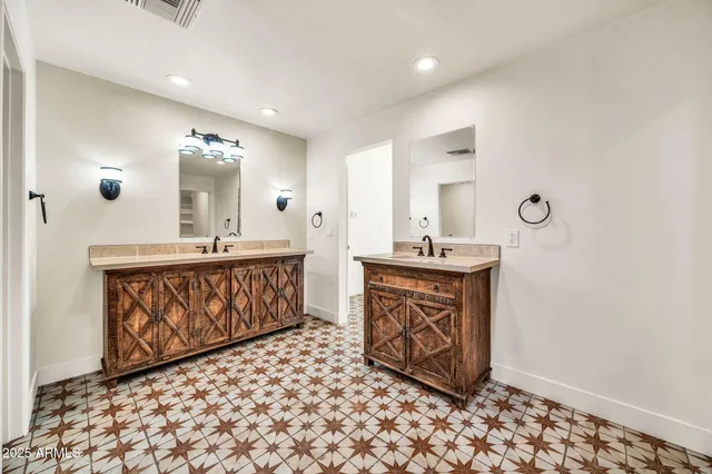 a kitchen with cabinets appliances and a sink