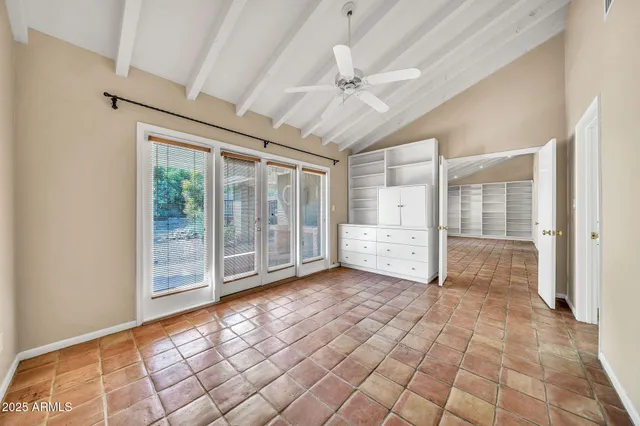 a bathroom with a granite countertop sink a toilet a mirror and bathtub