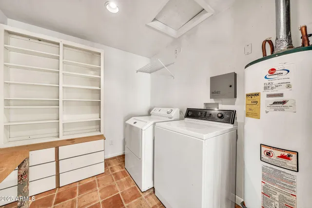 a view of a big room with wooden floor and windows