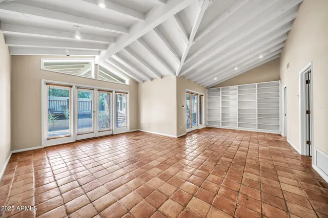 a view of a house with wooden fence