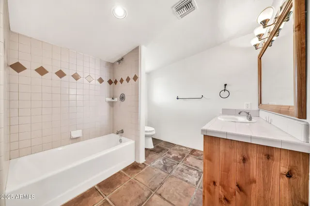 a view of a house with swimming pool and sitting area