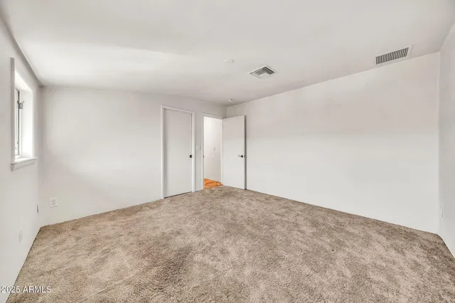 a front view of house with yard and swimming pool