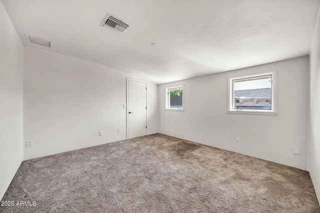 a view of a swimming pool with a yard