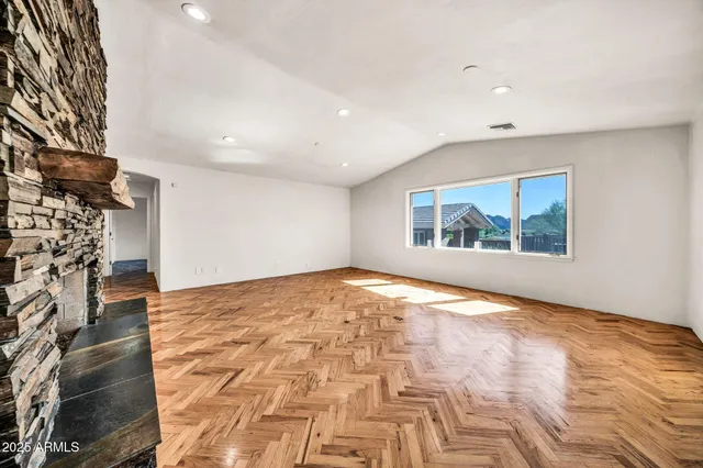a view of hallway with a bathroom and a sink