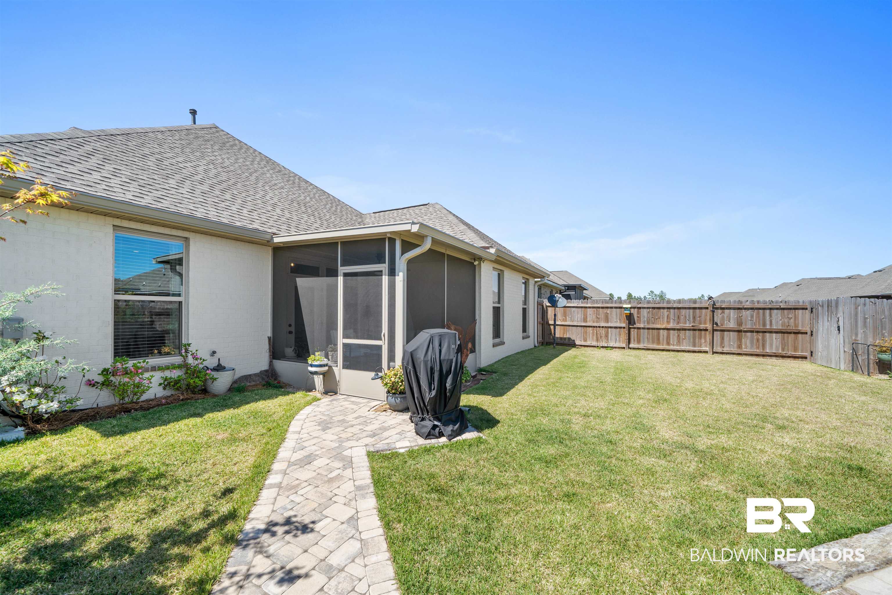 1509 Fenton Circle Foley, AL 36535 - Photo 29 of 34 View of yard featuring a fenced backyard and a sunroom
