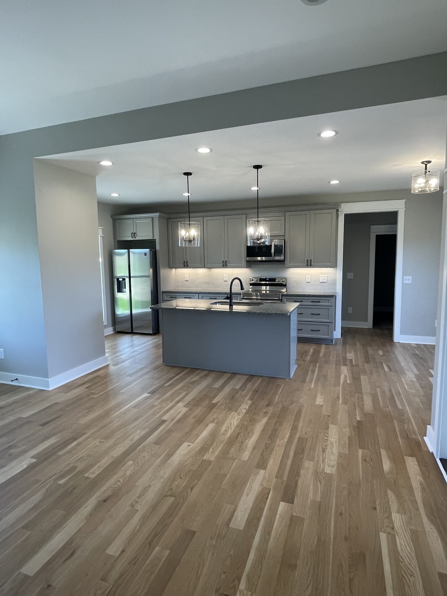 106 Freeland Road Portland, TN 37148 - Photo 4 of 23 a view of kitchen with cabinets and wooden floor