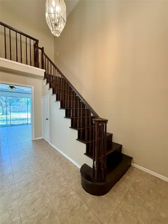 a view of entryway and hall with a front door