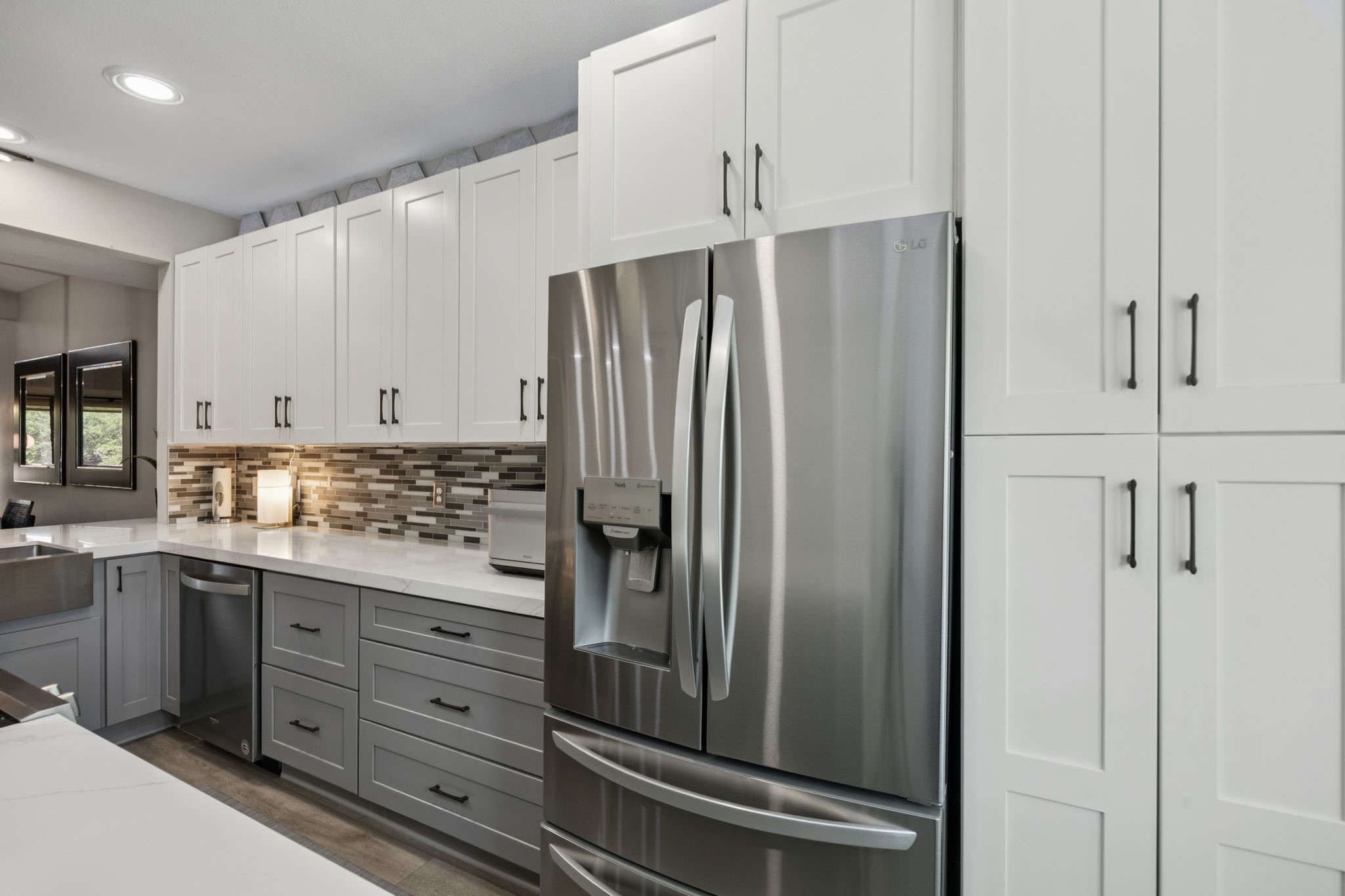 500 River Road, Unit 106 Montgomery, TX 77356 - Photo 11 of 31 a kitchen with stainless steel appliances a refrigerator and cabinets