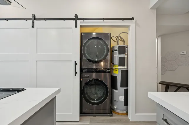 a kitchen with stainless steel appliances cabinets and a table
