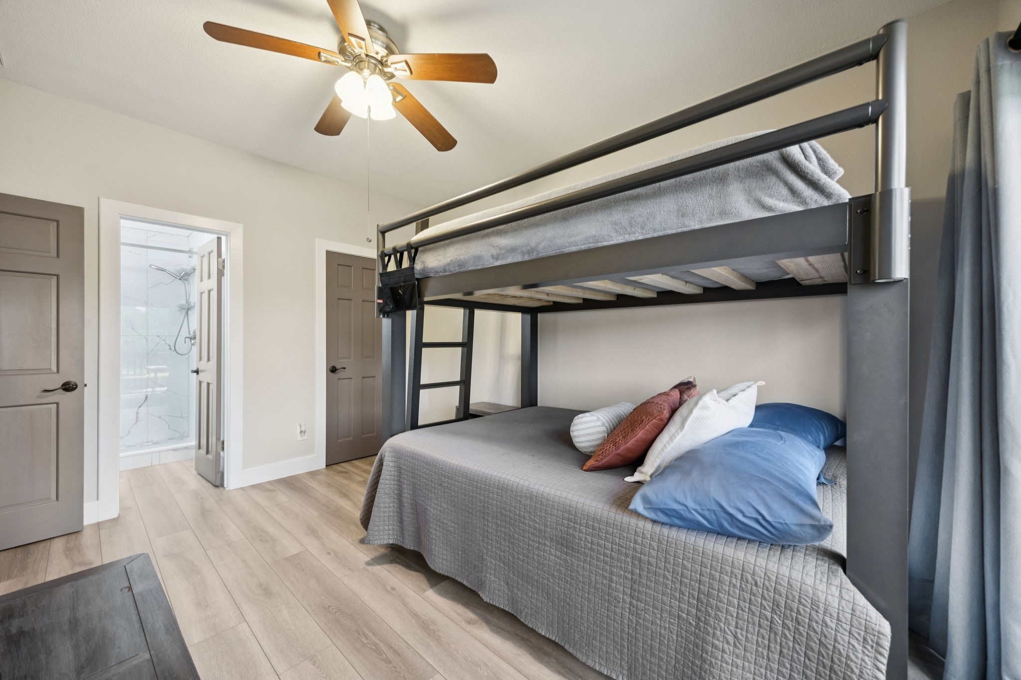 500 River Road, Unit 106 Montgomery, TX 77356 - Photo 16 of 31 a bedroom with a bed and a walk in closet