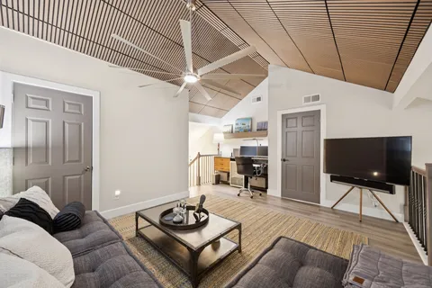 a view of bedroom with furniture and lamp