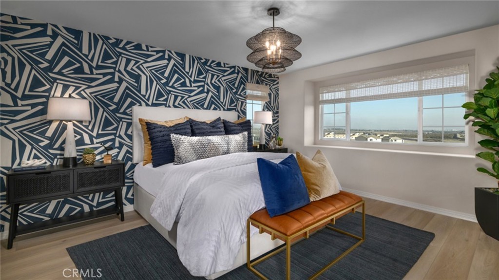 2439 Powell Drive Rialto, CA 92377 - Photo 5 of 17 a bed room with a bed and a chair