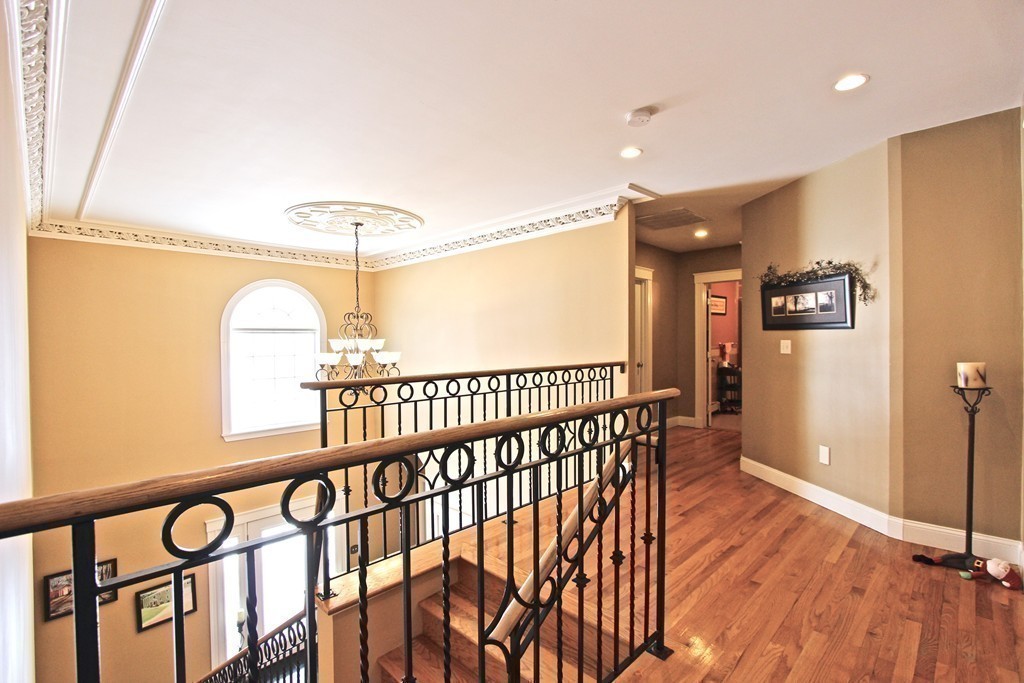 70 Summer Street Stoneham, MA 02180 - Photo 15 of 30 a view of staircase with railing and a chandelier