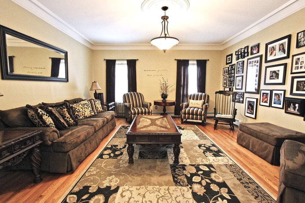 70 Summer Street Stoneham, MA 02180 - Photo 17 of 30 a living room with furniture and a large window