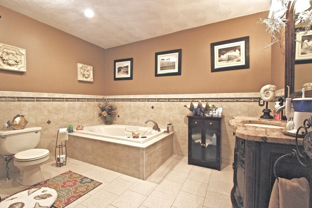 70 Summer Street Stoneham, MA 02180 - Photo 19 of 30 a spacious bathroom with a bathtub sink and toilet