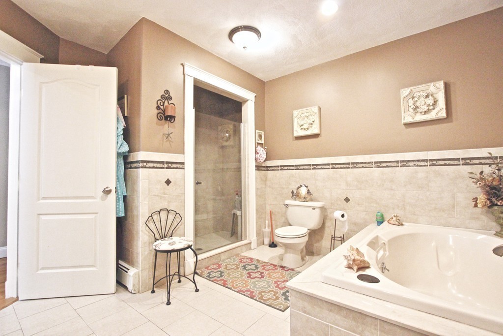 70 Summer Street Stoneham, MA 02180 - Photo 20 of 30 a bathroom with a tub and a sink